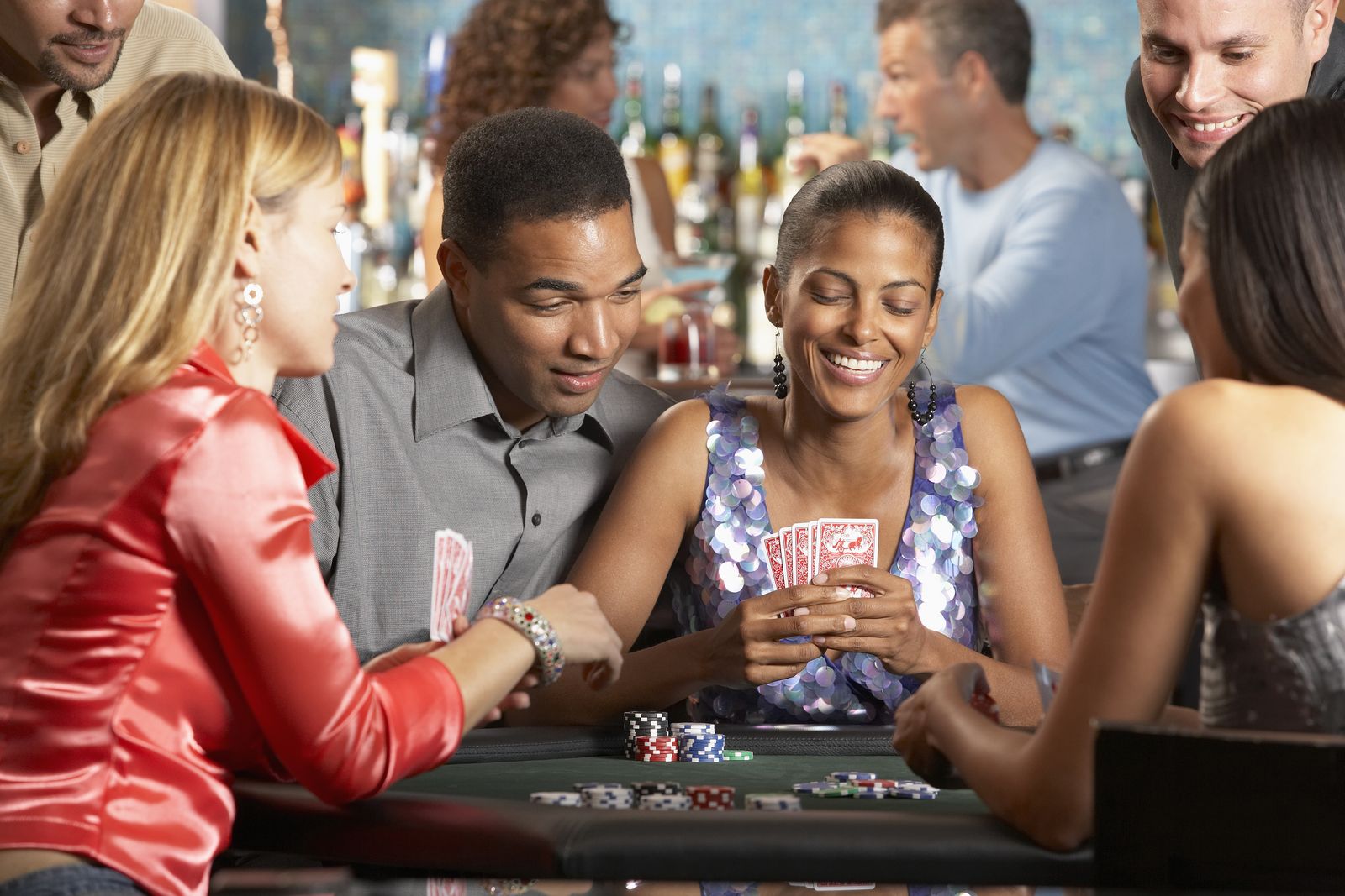 Staff enrolling a player on the casino floor